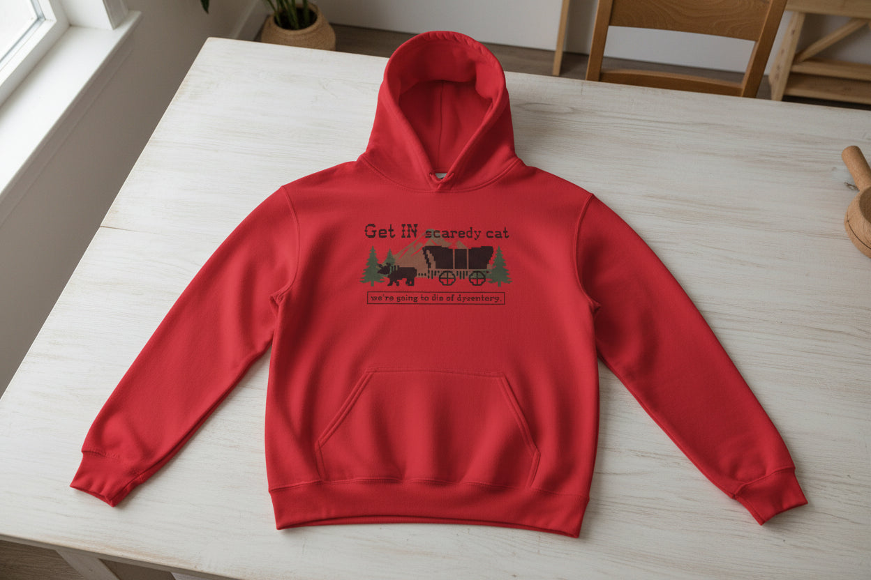 Retro Oregon Trail Dysentery Graphic Pullover in sand with light blue and pink Scaredy Cat wagon illustration.