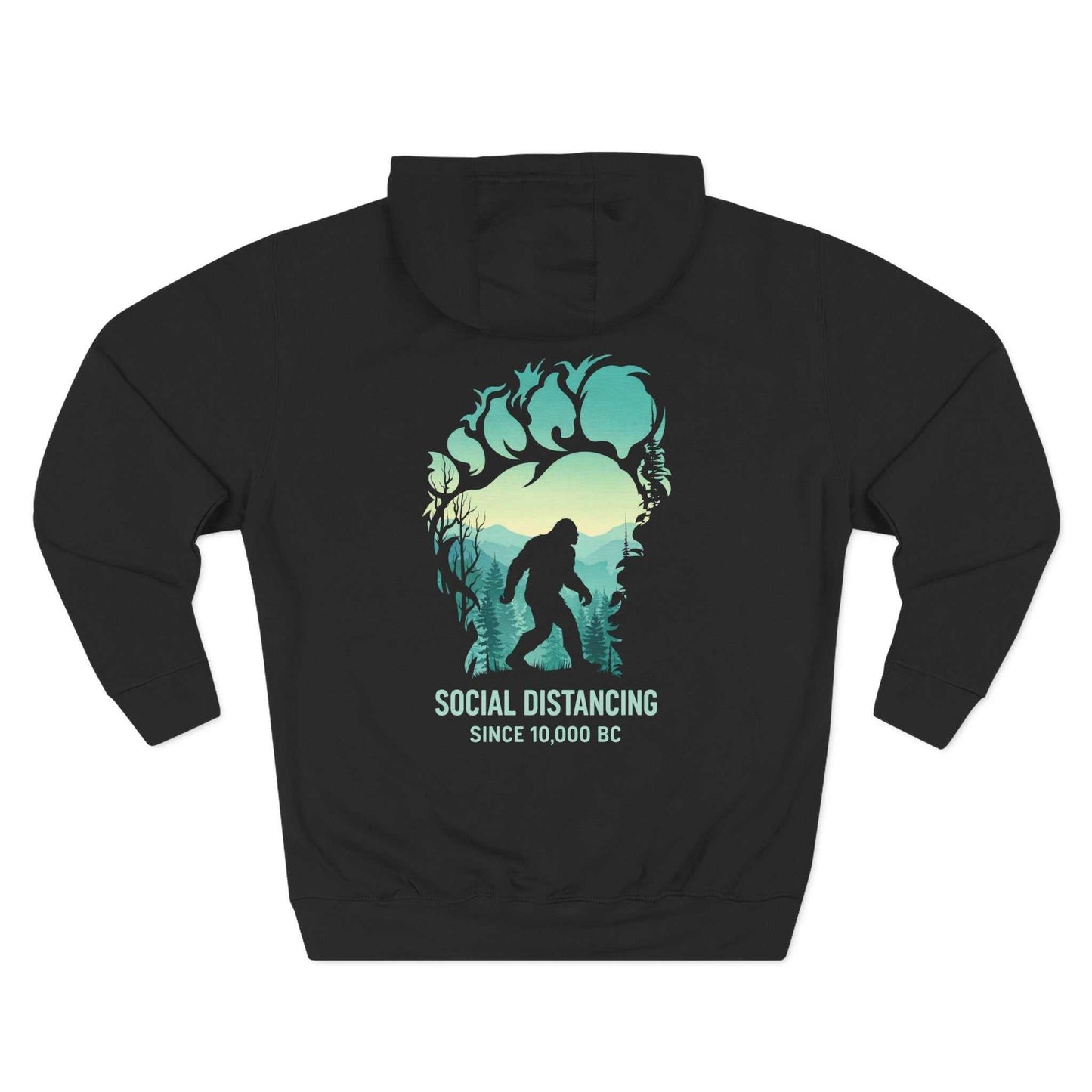 "The Bigfoot Social Distancing Hoodie in a cozy fleece pullover style, featuring a silhouette of Sasquatch and the text 'Social Distancing Since 10,000 BC'."