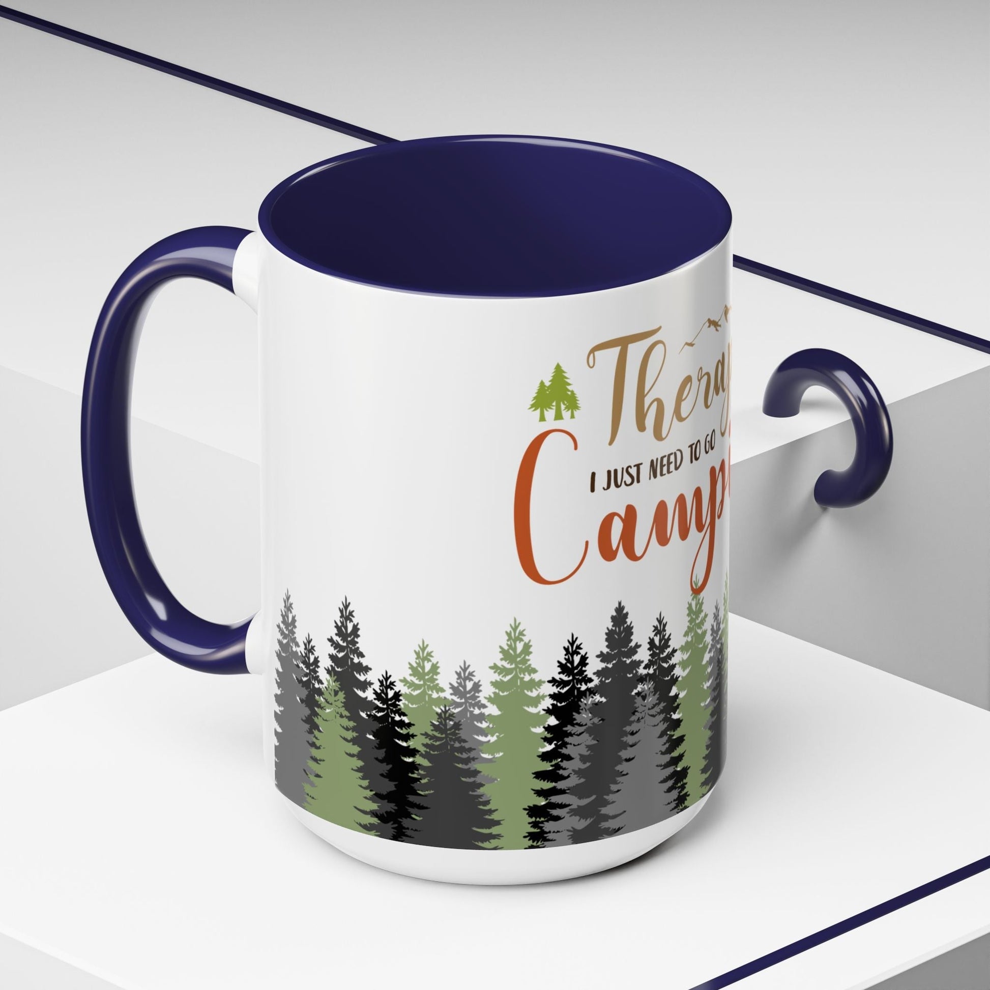 A person holding the I Don't Need Therapy I Just Need To Go Camping Mug next to a morning campfire.