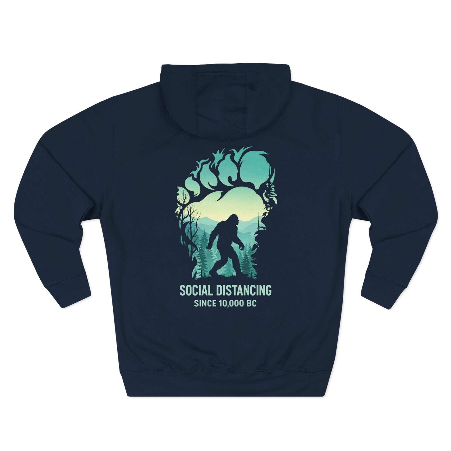 "The Bigfoot Social Distancing Hoodie in a cozy fleece pullover style, featuring a silhouette of Sasquatch and the text 'Social Distancing Since 10,000 BC'."