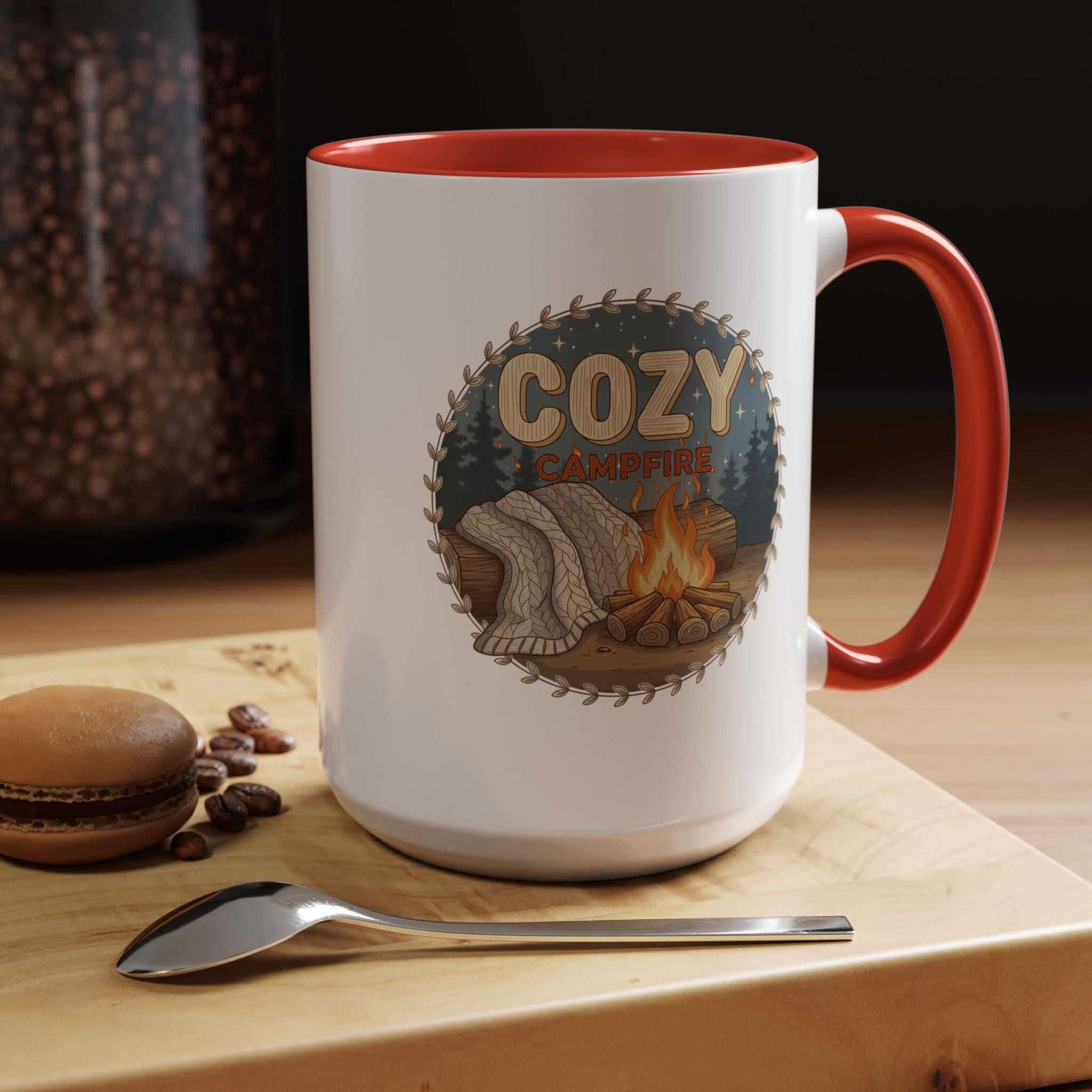 A Cozy Campfire Mug in speckled ceramic with a red rim, filled with hot coffee and sitting on a wooden surface
