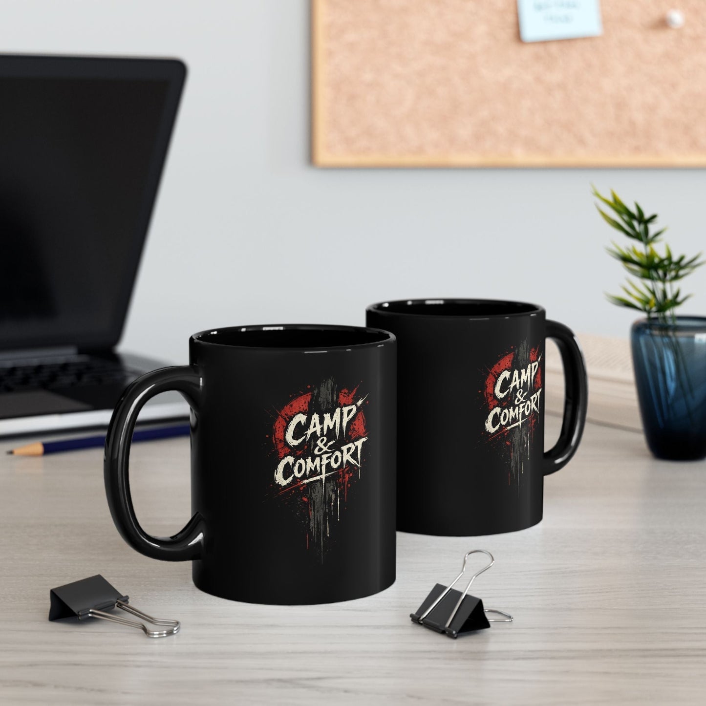 "The Camp & Comfort Splatter Mug Official Sweepstakes prize, featuring a black ceramic finish with a red and white distressed 'splatter' logo design."